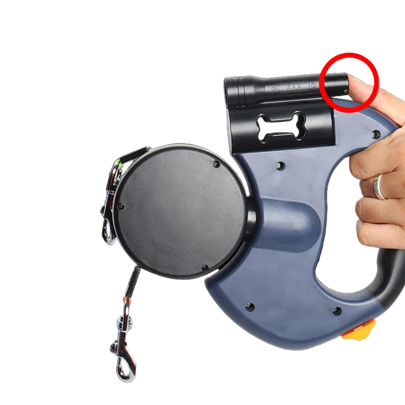 Retractable cable reel with flashlight and hand holding it on a black background