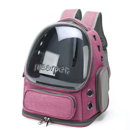 Pink pet carrier backpack with clear front panel on a white background
