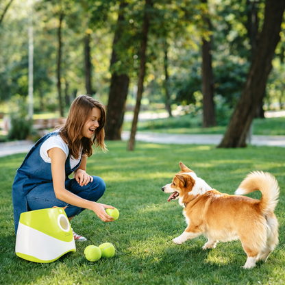 Woman playing with a dog in a park with green grass and trees.